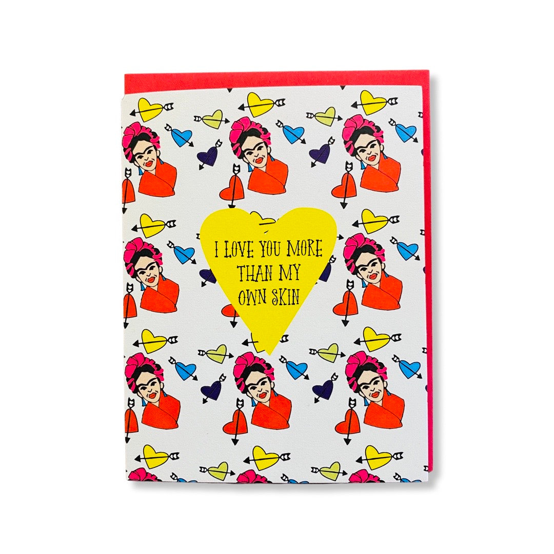 I Love You More Than My Own Skin Frida Kahlo greeting card. Design features Frida print with cupid hearts.