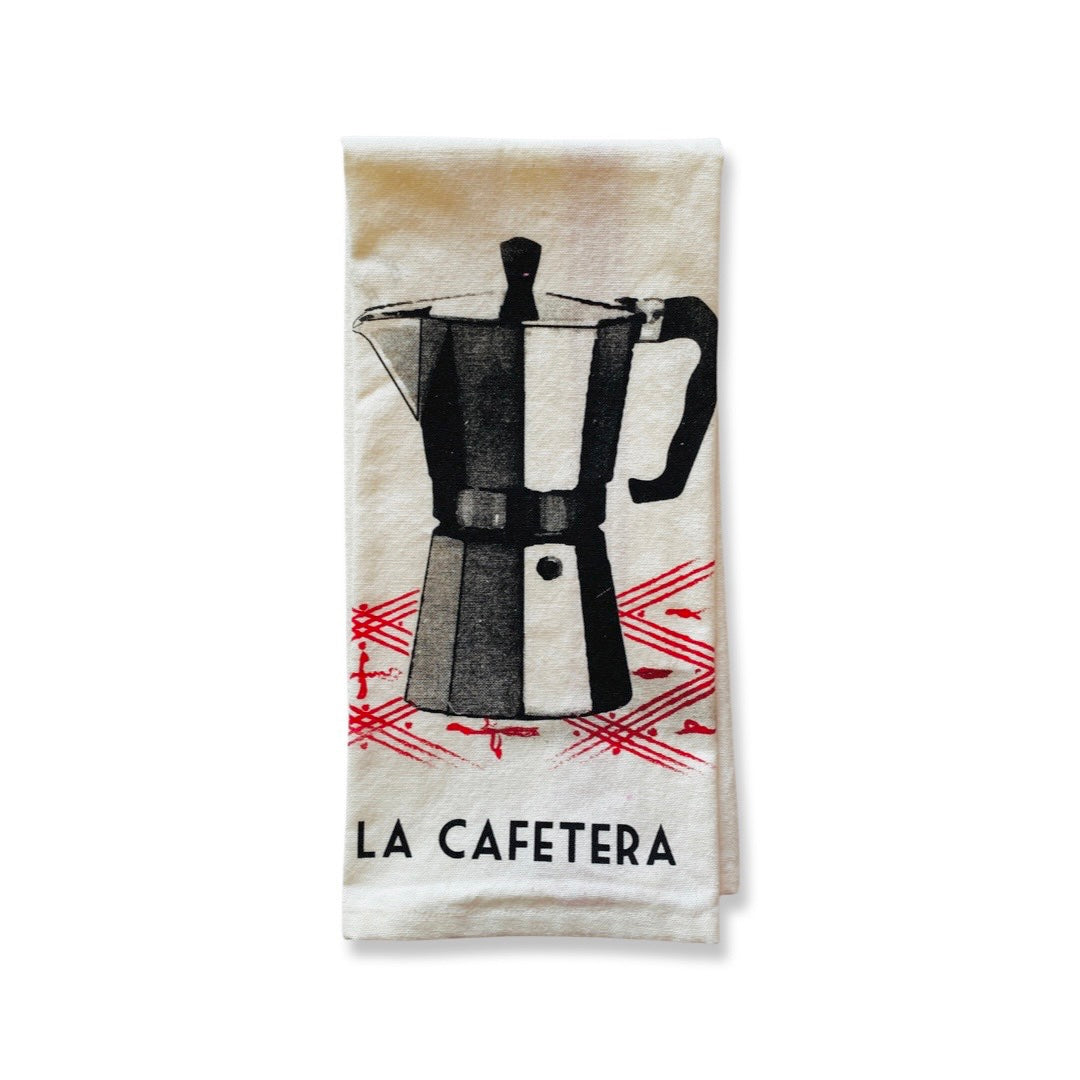 Lotería Dish Towel features image of cafetera with phrase "La Cafetera." Dish towel is natural color with red and black accents. 