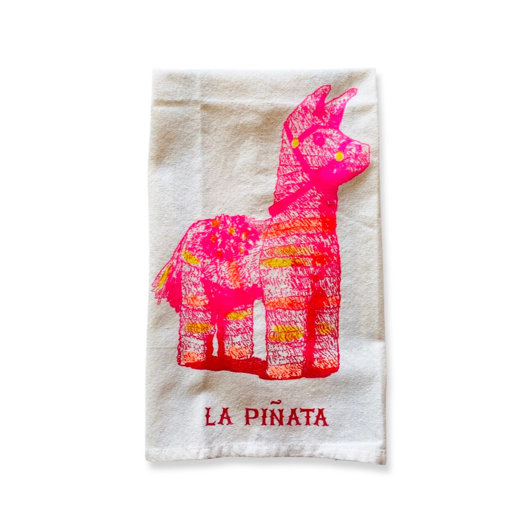 Loteria dish towel featuring a bright pink piñata.  