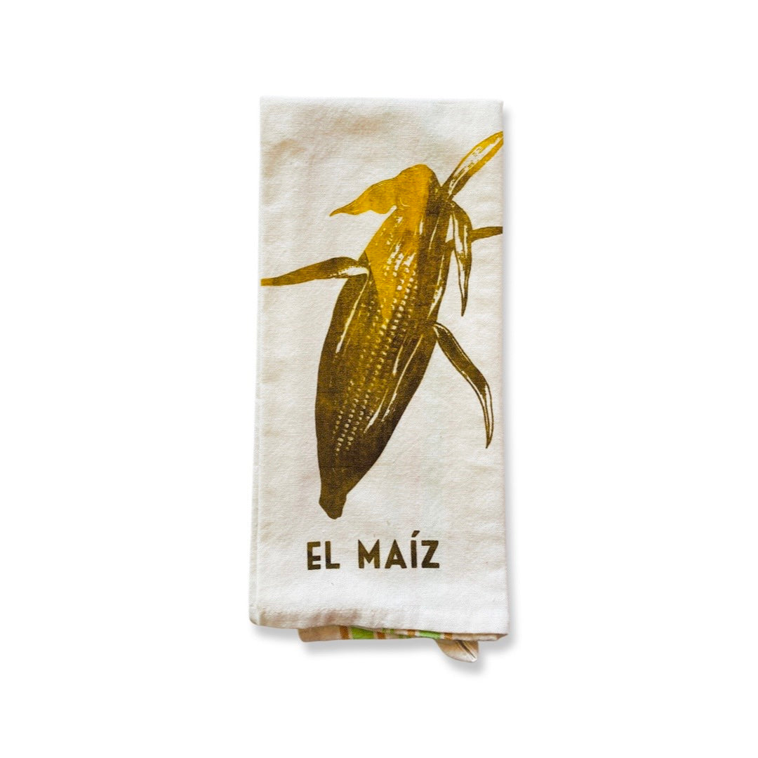 Loteria dish towel featuring el maiz (corn) image and phrase.