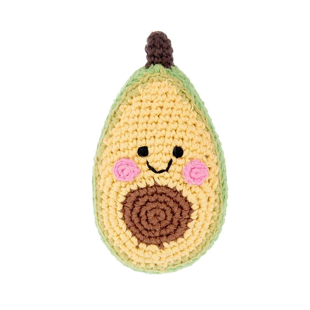 Friendly, smiling avocado rattle. It has a brown pit and stem.
