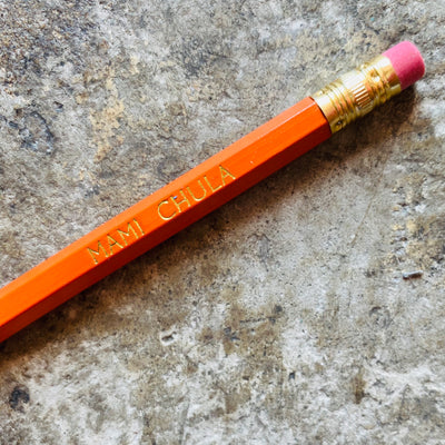 Close up of orange Mami Chula phrase pencil.
