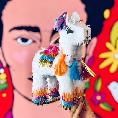 Mini llama piñata with colorful and metallic detailing