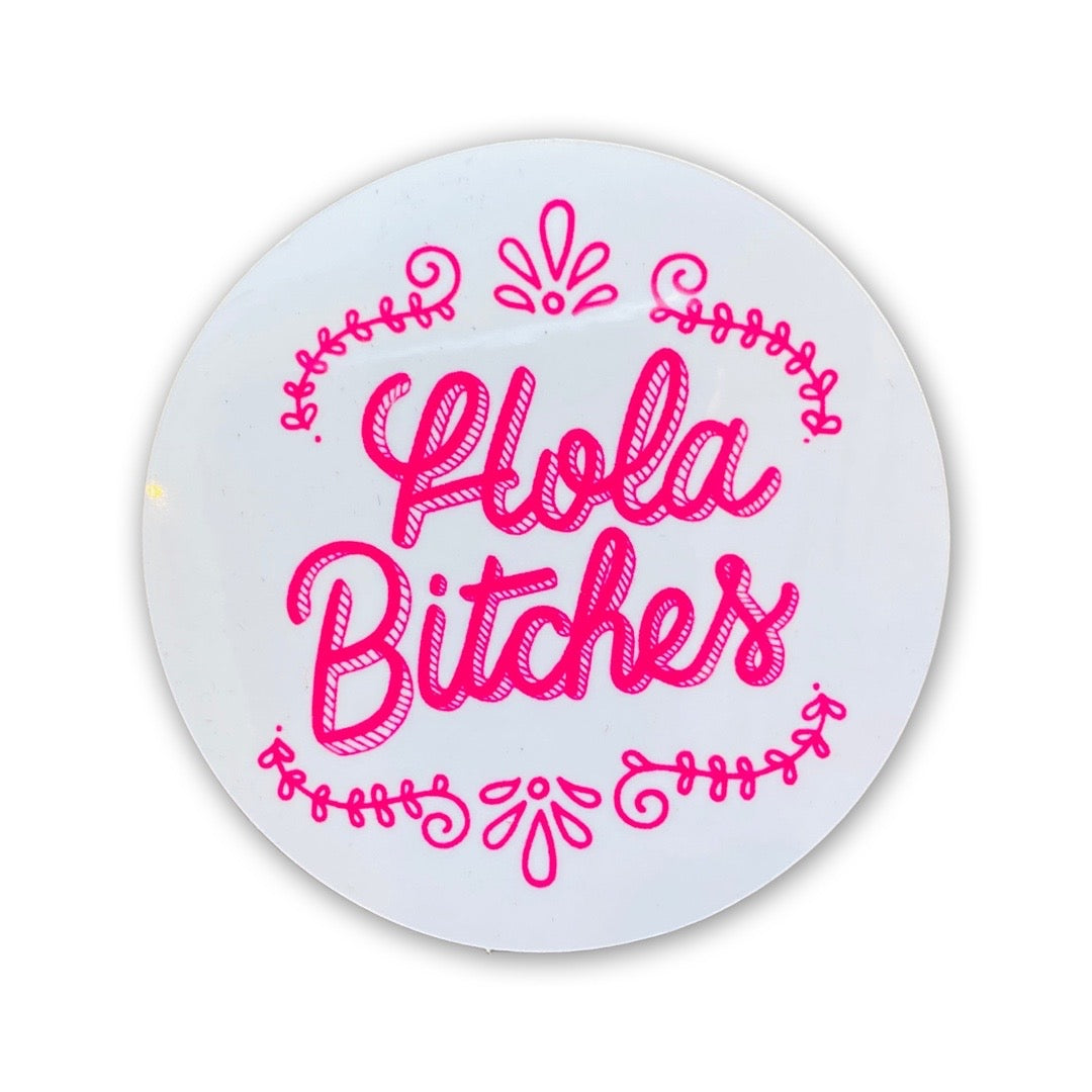 white round sticker with the phrase Hola Bitches in cursive and pink lettering