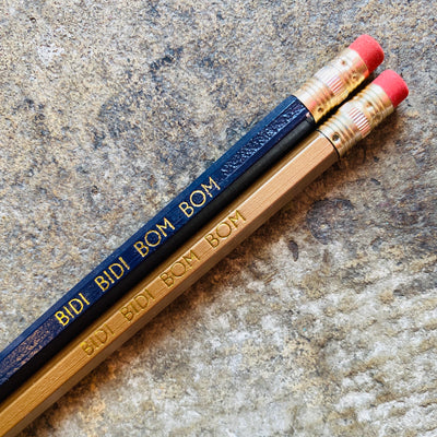 Bidi Bidi Bom Bom phrase pencils in black and gold.
