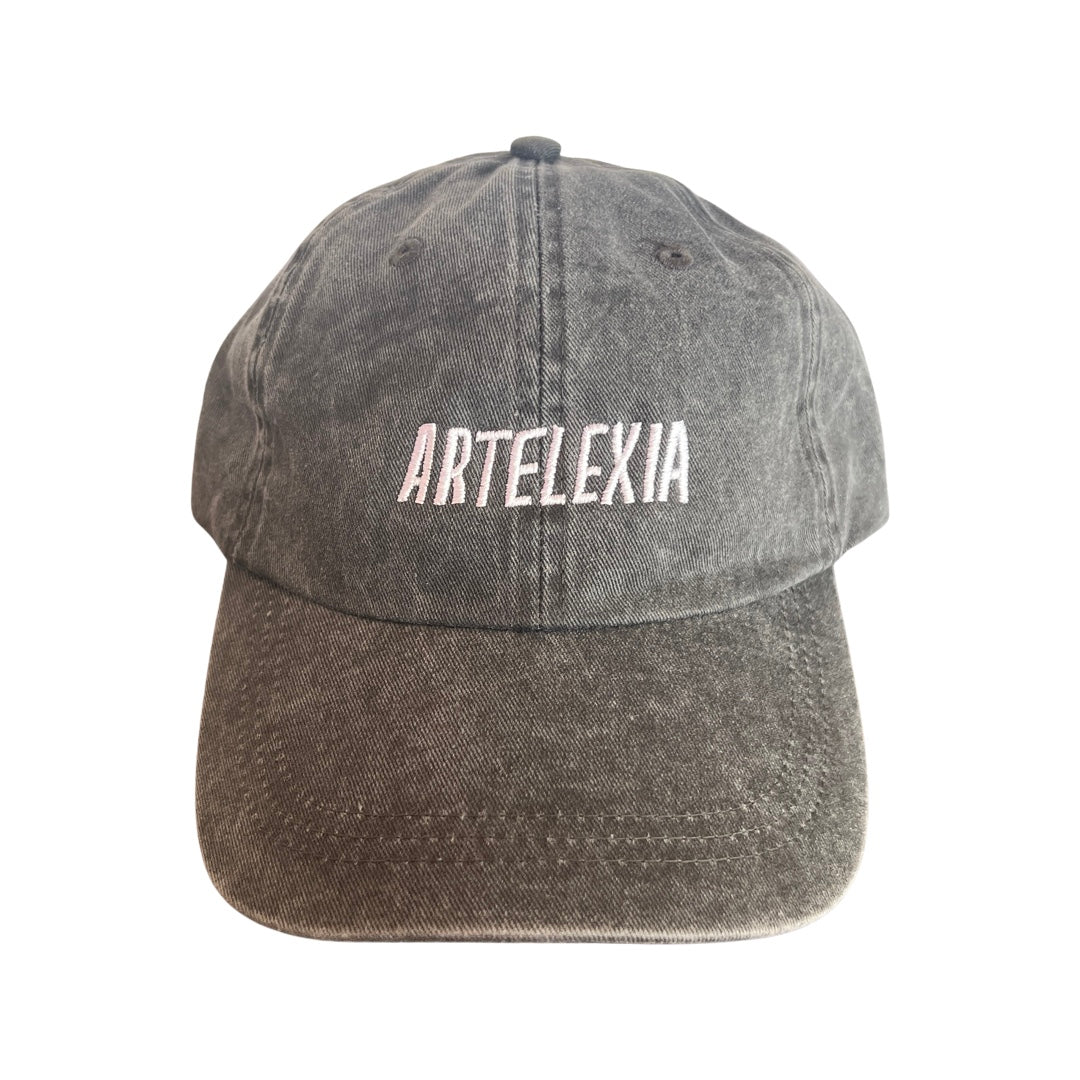 Heathered black hat with the word Artelexia in white lettering