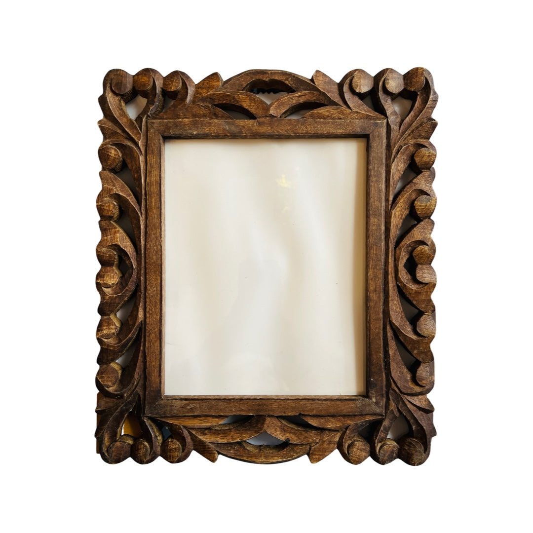 wooden 8 x 10 photo frame that features a hand carved design