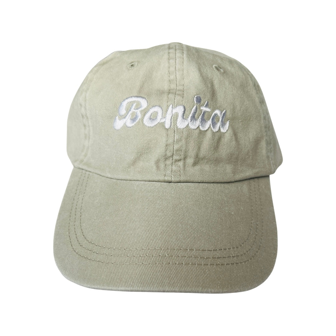 Khaki canvas hat with the phrase Bonita in white embroidered lettering.