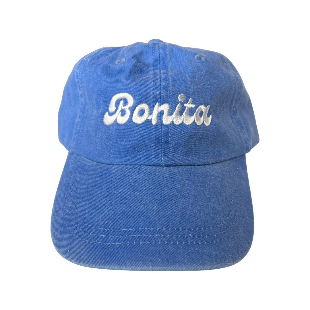 Light blue canvas hat with the phrase Bonita in white embroidered lettering.