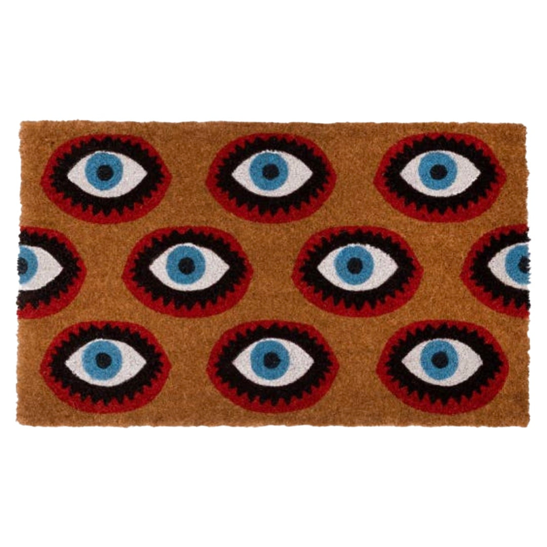 Doormat with a pattern of eyes. the eyes are black, red,blue and white.