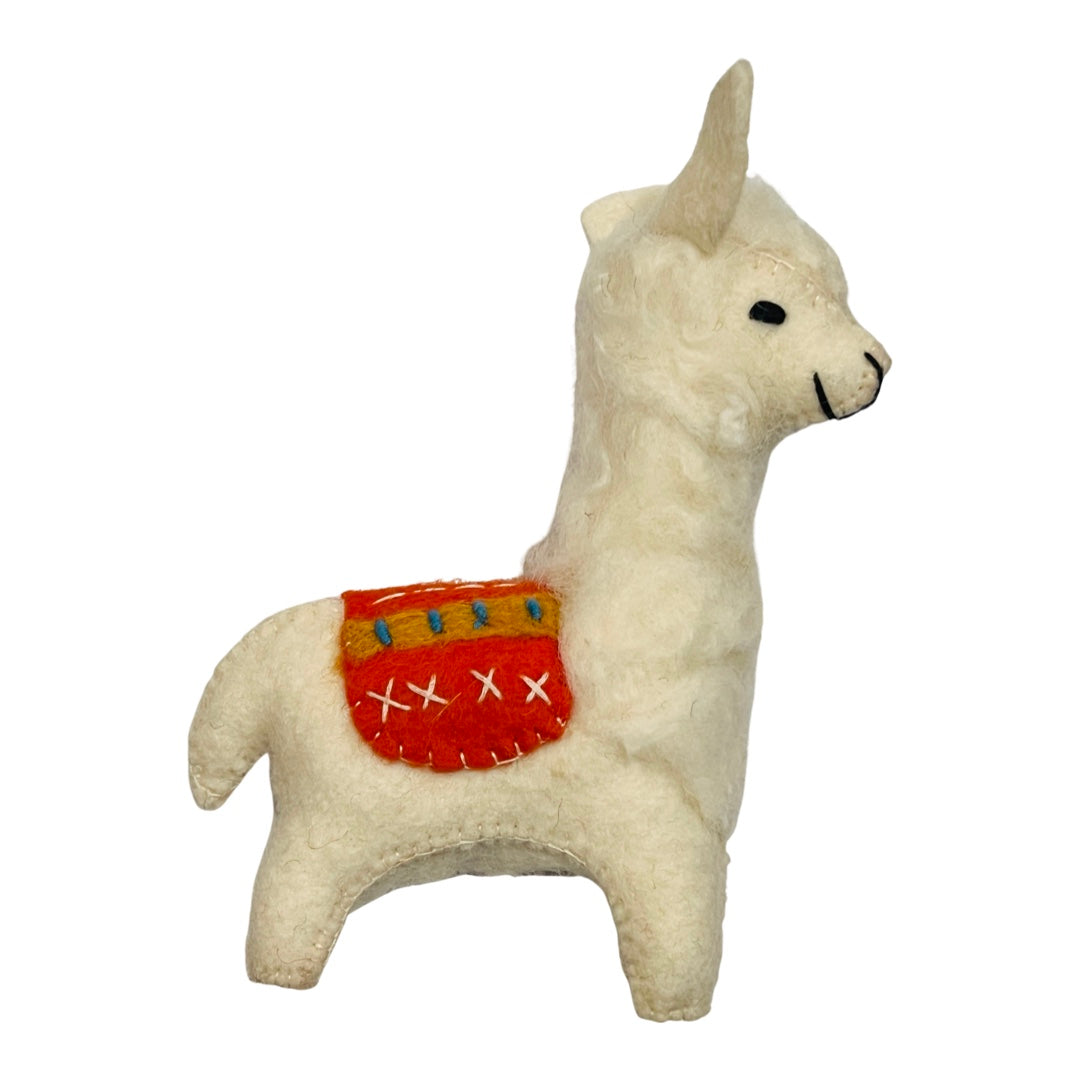 White felt llama with an orange, yellow and blue blanket on its back.
