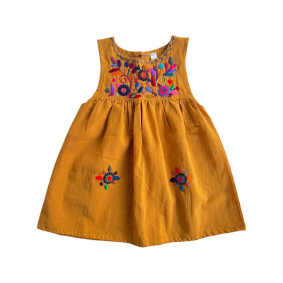 Mustard dress with multi-colored embroidered flowers on the top and a pair of flowers on the bottom.