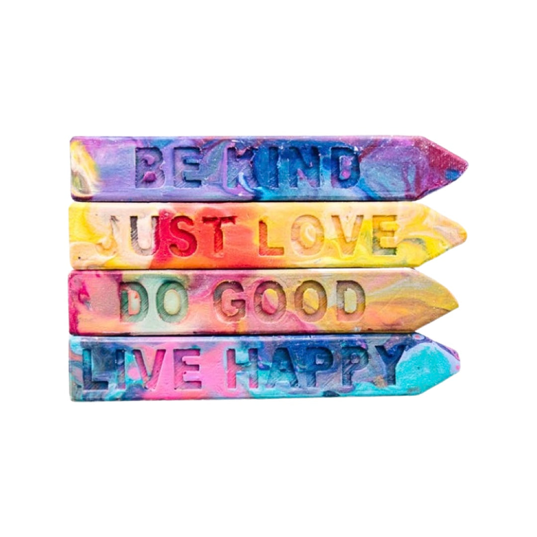 Set of 4 rainbow colored crayons with the phrases Be Kind, Just Love, Do Good and Live Happy.