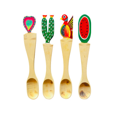 Large colorful Oaxacan painted wooden spoons. From left to right designs include: heart, cactus, bird, and watermelon. 