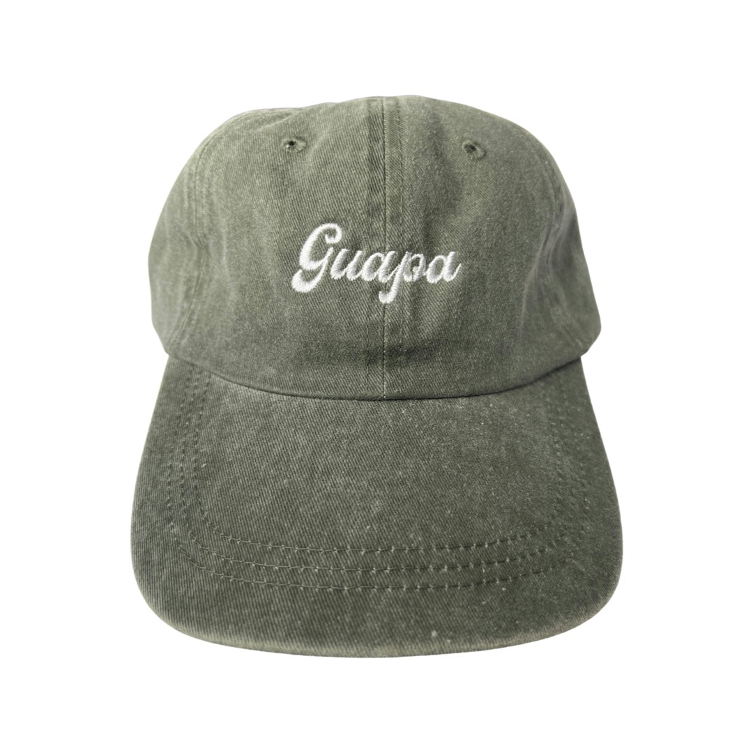 Olive canvas hat with the phrase Guapa in white embroidered lettering.